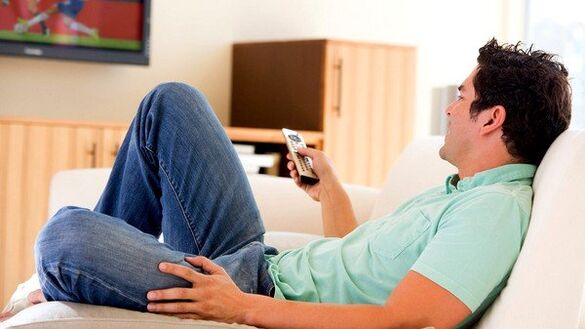 The man watches the TV